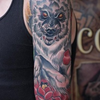 Usual style colored shoulder tattoo of creepy wolf with rose
