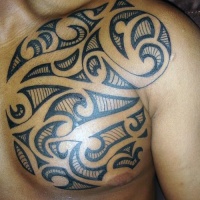 Usual style painted little black ink tribal tattoo on chest