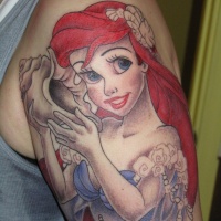 Very beautiful looking colored shoulder tattoo of cartoon mermaid Ariel with shell