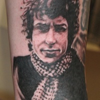Very detailed black ink forearm tattoo of mans portrait