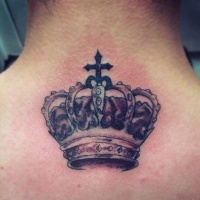 Very detailed crown and cross tattoo on the back