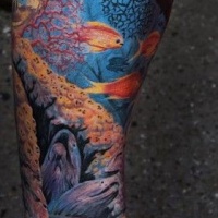 Very fine details of  seabed tattoo on leg by Remis