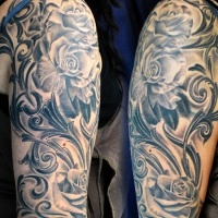 Very realistic black and white big roses arm tattoo