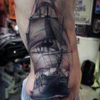Very realistic looking black and white big old ship tattoo on side