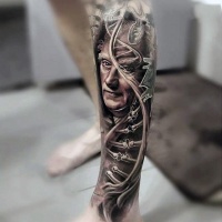 Very realistic looking colored old man portrait with DNA tattoo on leg