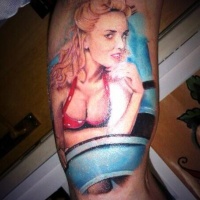 Very realistic looking colored sexy woman tattoo on arm
