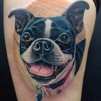 Very realistic looking funny dog colored portrait tattoo on thigh