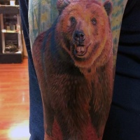 Very realistic looking natural colored bear half sleeve tattoo