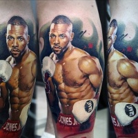 Very realistic looking photo like colored famous boxer tattoo on leg