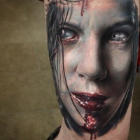 Very realistic painted and colored bloody vampire movie woman hero tattoo on arm