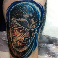 Vintage horror movie themed colored thigh tattoo of werewolf