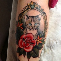 Vintage like colored tattoo of cat portrait with flowers