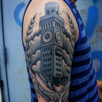 Vintage picture like colored old clock tower tattoo on shoulder with little bird