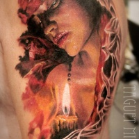Vintage picture like colored shoulder tattoo of woman with big candle