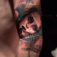 Vintage picture style colored forearm tattoo of woman face