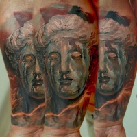 Vintage picture style colored forearm tattoo of fantasy ancient statue