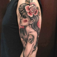 Vintage picture style colored shoulder tattoo of woman with flowers and skull