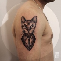 Vintage portrait like awesome looking shoulder tattoo of cool cat in tox