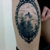 Vintage portrait like black ink thigh tattoo of mountain forest
