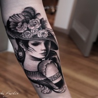 Vintage style black ink arm tattoo of woman with beautiful flowers