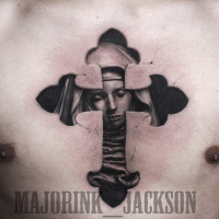 Vintage style black ink chest tattoo of cross stylized with woman statue