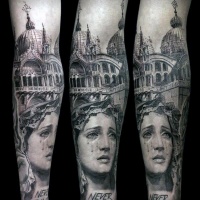 Vintage style black ink forearm tattoo of woman statue with old cathedral