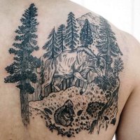Vintage style black ink wild cow in forest tattoo on upper back