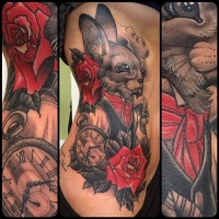 Vintage style colored cute rabbit tattoo on side combined with red rose and clock