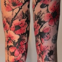 Vintage style colored forearm tattoo of blooming flowers