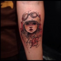 Vintage style colored forearm tattoo of cute girl with signature