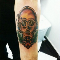Vintage style colored funny C3PO head tattoo on forearm with flower