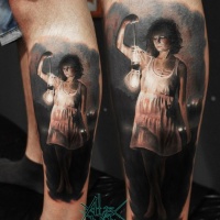 Vintage style colored leg tattoo of mystical woman with bulb