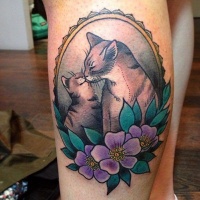 Vintage style colored leg tattoo of cat family with flowers