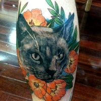 Vintage style colored leg tattoo of cat with nice flowers