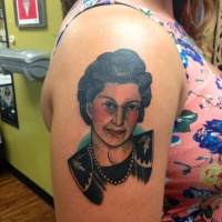 Vintage style colored on shoulder tattoo of old woman portrait