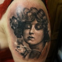 Vintage style colored shoulder tattoo of woman portrait with tree branch