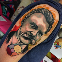 Vintage style colored shoulder tattoo of man with mustache and stone