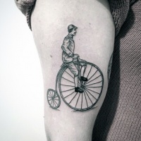 Vintage style painted big antic bicycle tattoo on thigh