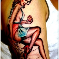 Vintage style painted colored seductive baker woman tattoo on shoulder zone