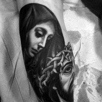 Virgin Mary and Jesus Christ in crown of thorns with bloody face traces religious tattoo