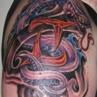 Vivid colors snake tattoo on shoulder