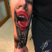 Vivid colors tongue and scissors forearm tattoo