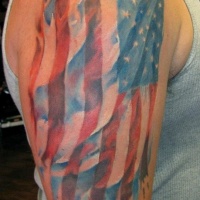 Watercolor american flag tattoo on shoulder
