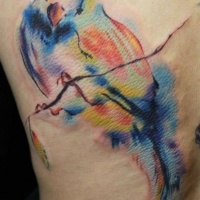 Watercolor bird tattoo on ribs