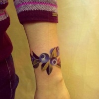 Watercolor bracelet with blueberries tattoo on wrist