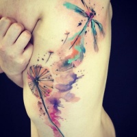 Watercolor dragonfly and dandelion tattoo on ribs