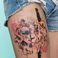 Watercolor half woman half tigress tattoo on thigh
