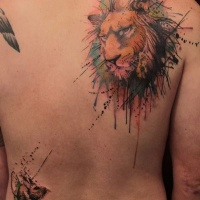 Watercolor lion tattoo on back