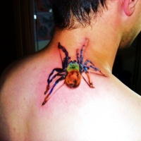 Watercolor spider tattoo on neck