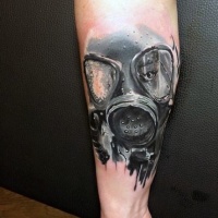 Watercolor style amazing looking woman in gas mask tattoo on forearm
